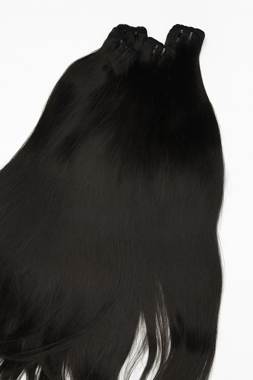 Black hair extensions with clips on a white background